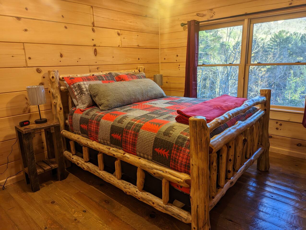 Cozy bedroom with mountain cabin styling at Heaven’s View