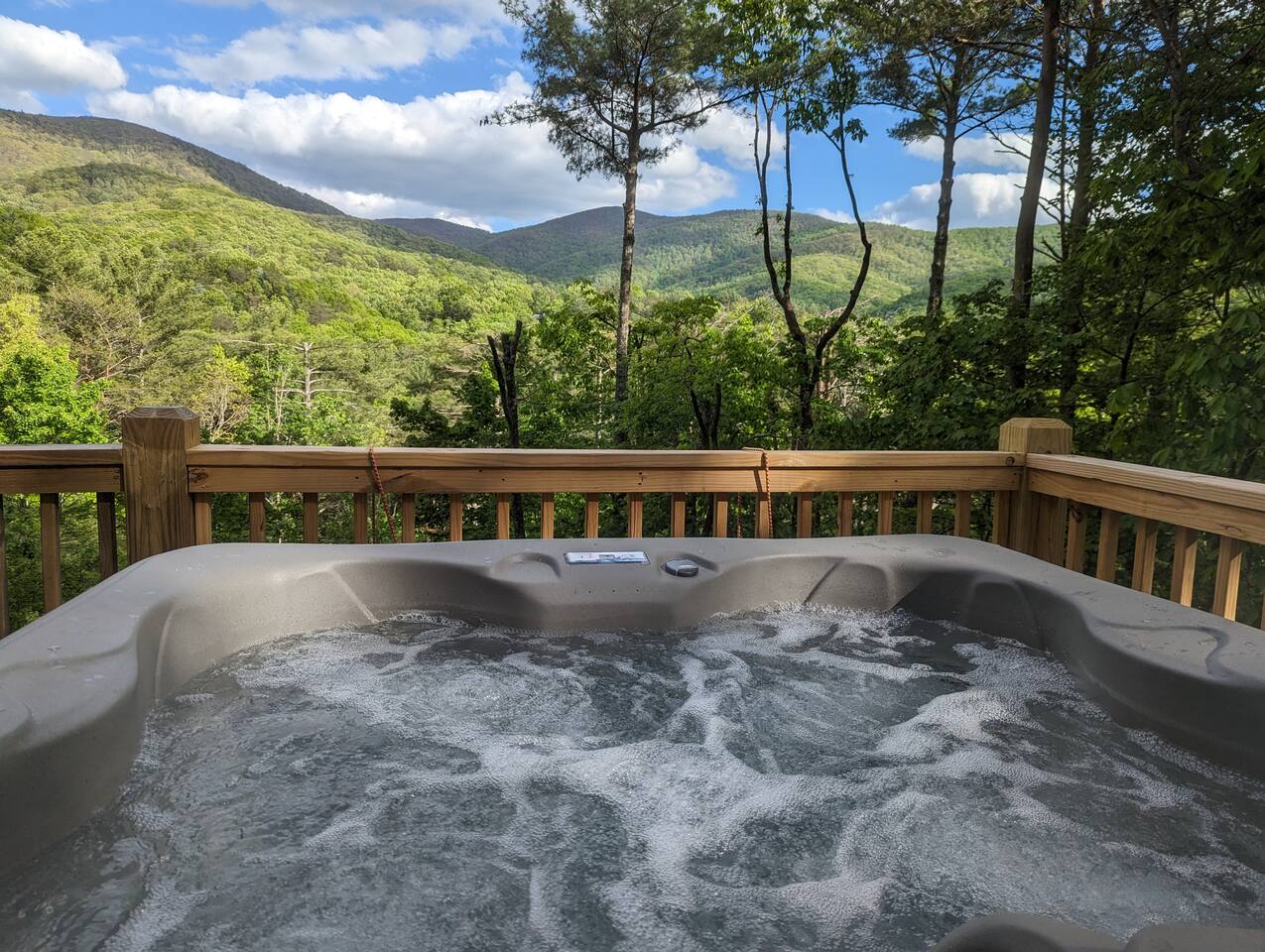 Private hot tub with scenic mountain views at Heaven’s View cabin